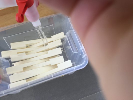 Hydrogen peroxide pouring into the containers