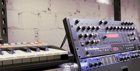 The rack with Alpes Machines controller, Matrix, and Lexicon reverb next to a keyboard controller (a Novation SL MKII)